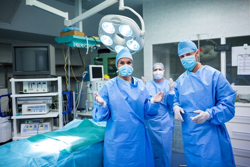 Portrait of surgeons preparing for operation in operation room at the hospital